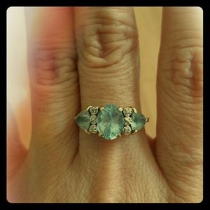 10k Aquamarine and diamond chips.